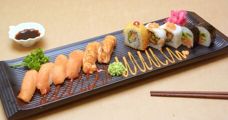 Delicious Salmon Sushi Rolls with Spicy Sauce and Avocado