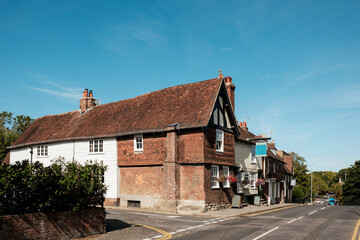 English village street corner with historic half-timbered house