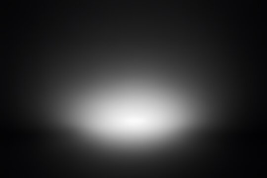 Abstract black and white gradient background with a soft, blurred light source.