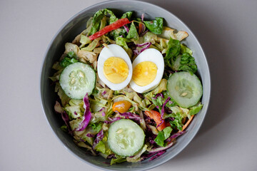 Healthy raw vegetable salad with boiled egg