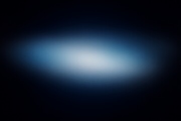 Obraz premium Abstract blurred background with a soft light in the center, surrounded by dark blue and black.