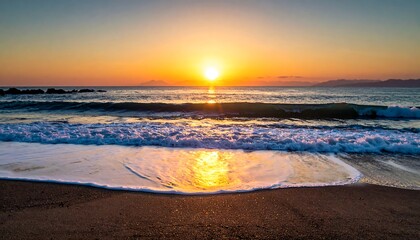 A golden sunset over the ocean waves kissing the sandy shore
