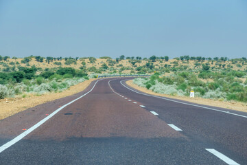 Road through the desert between Jaisalmer and Tanot, near Jaisalmer India.