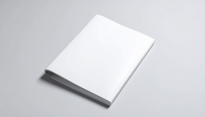 Minimalist white book mockup on a gray surface for design and presentation