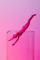A surreal visual of a bright pink human figure in a dynamic pose splashing into a clear glass against a colorful gradient
