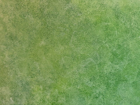 Decorative green textured paint on a wall or panel. Red washed paint with random brush strokes, grunge, and dirt pattern. Seamless background texture.