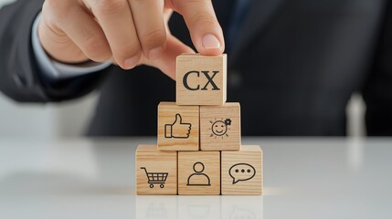 Businessman building wooden cube pyramid with CX and customer experience icons such as shopping cart, like, communication, and idea, symbolizing service quality, marketing strategy, and customer satis