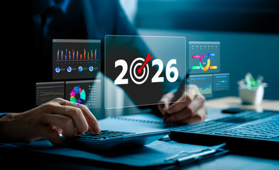 Business target and financial planning concept for 2026 with businessman analyzing digital charts...