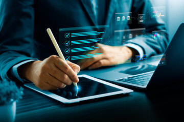Digital checklist and task management concept with businessman using stylus on tablet to complete...