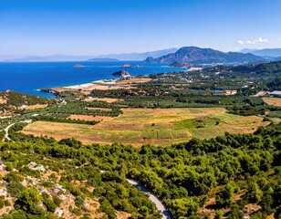 Coastal landscape view lush fields, ocean, mountains