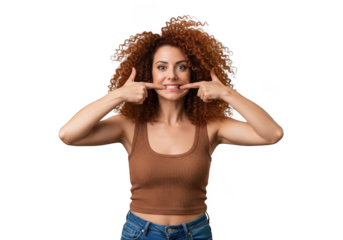Smiling woman with curly hair pointing at teeth, dental health concept, isolated portrait, isolated on transparent background
