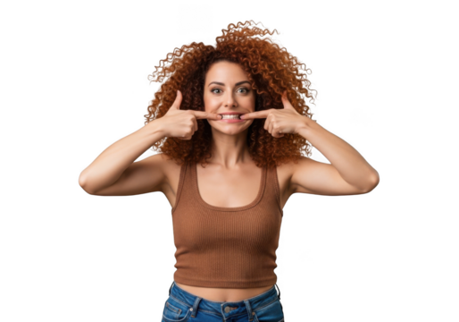 Smiling woman with curly hair pointing at teeth, dental health concept, isolated portrait, isolated on transparent background