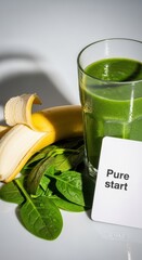 Healthy green smoothie with banana and spinach for a pure start