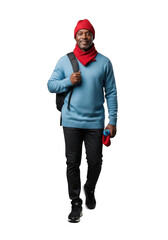Full body shot of a man walking with a red hat and scarf, blue sweater, black pants, and backpack, png image, isolated on transparent background