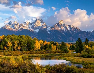 Scenic mountain range and lake in autumn with golden sunlight