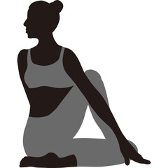 Silhouette of a woman performing a yoga pose in a studio with a plain background wearing grey athletic wear