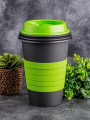 Black and green disposable coffee cup with lid against a textured background.