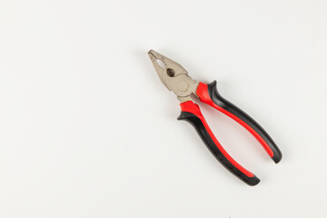 Pliers on a clean white surface for various repair tasks and projects