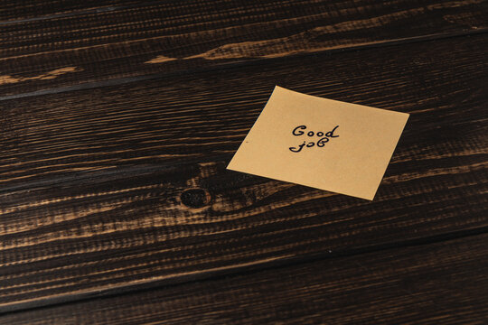 Encouraging note on a desk shows support for hard work