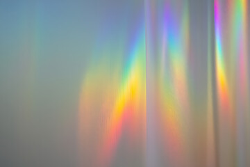 Abstract rainbow light streaks and prismatic reflections creating a vibrant and dreamy background