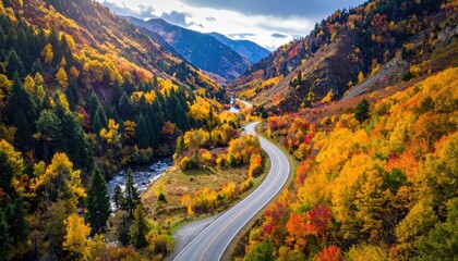 Winding Road Through a Mountain Valley Displaying Vibrant Autumn Foliage With A Serene River Flowing Alongside Under A Dramatic Cloudy Sky