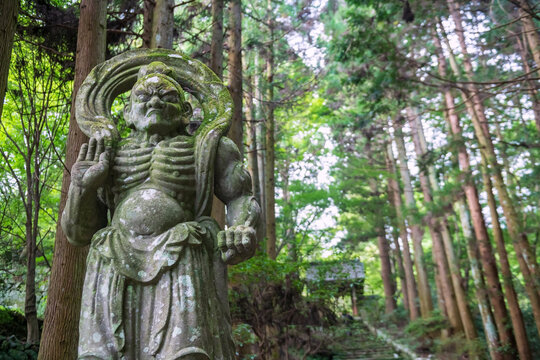 Stone Nio Guardian statue at entrance of Futagoji Temple, Oita