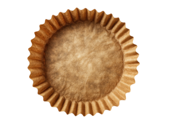 Empty brown paper cupcake liner, fluted edges, overhead view