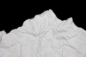 White paper cut with torn edges isolated on black background.