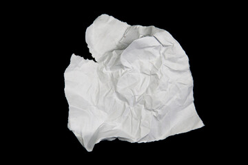 White paper cut with torn edges isolated on black background.