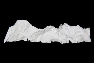 White paper cut with torn edges isolated on black background.