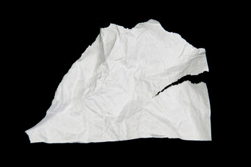 White paper cut with torn edges isolated on black background.