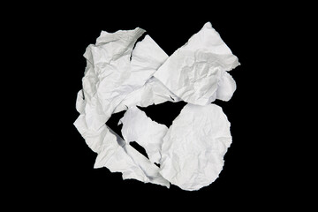 White paper cut with torn edges isolated on black background.