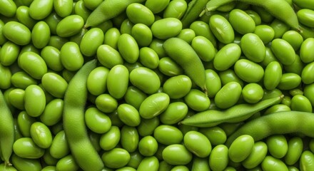 A closeup, fullframe shot of fresh, green edamame pods and beans, showcasing their vibrant color and natural texture