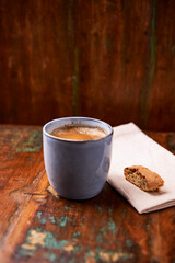 Cup of coffee on rustic wooden background. Soft focus. Copy space	