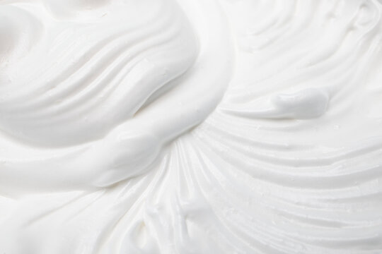 Mixed merengue cream, selective focus close up, full frame backdrop