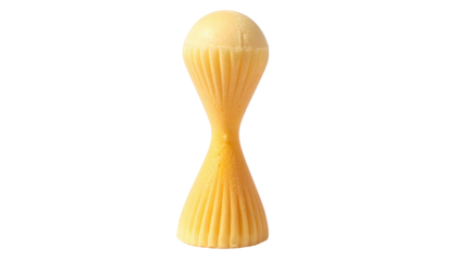 Tall, creamy, golden-white chocolate sculpture with a pinched hourglass shape and delicate, vertically ribbed texture