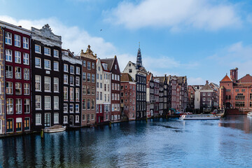 Unique architecture along the canal in Amsterdam showcases historic Dutch buildings