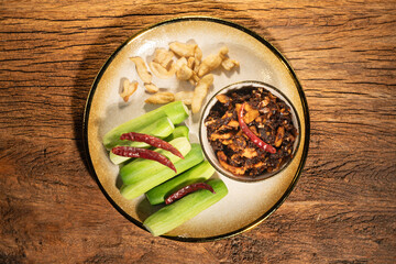 Pork Crackling Chili Paste (Nam Phrik kak Moo): Crispy, spicy, and savory. This Thai relish features crunchy cracklings, chili, and herbs. Served with fresh cucumber. A perfect crunch with hot rice.