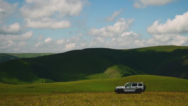 clouds float quickly over the tank 300 machine on the green slopes of the Elbrus region
