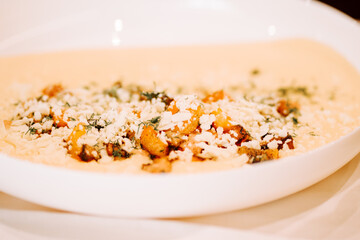 Delicious vegetarian dish served on a white plate at a cozy restaurant