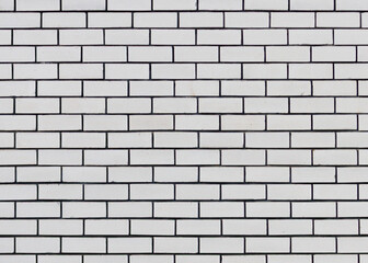 A white brick wall with black lines