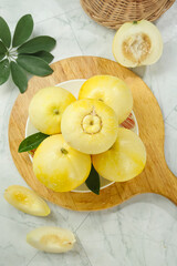 Fresh Golden Sweet Melons on Wooden Board with Green Leaves - Healthy Organic Fruit Display