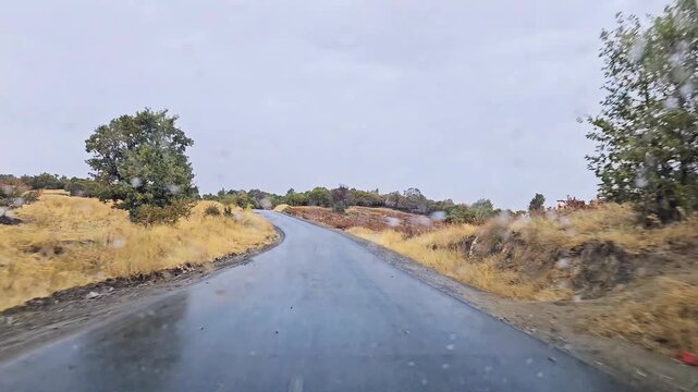 Driving along a wet forest road on a rainy autumn day through Zagros oak forests, showing moody nature, winding road, and seasonal landscape.
📍Marivan, Kurdistan 