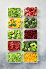 Frozen food banner. Plastic containers with frozen vegetables. Top view.