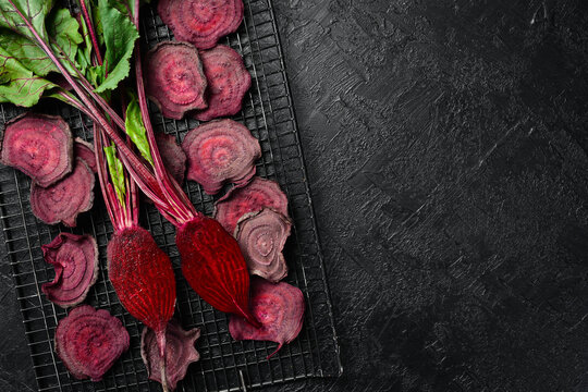 Dried beet slices. Healthy vegetable chips. Top view. Food concept.