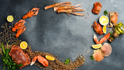 Fresh seafood. Wide food banner. Fish, octopus, lobster and other seafood on a gray stone table.