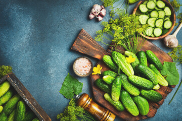 Background of fresh organic farm cucumbers on table. Free space for text. Top view.