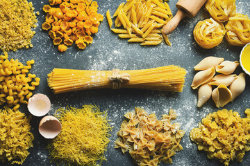 Raw pasta - gluten free. Set of different types of pasta on kitchen background.