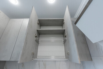 Open cabinet with Dish drainer.