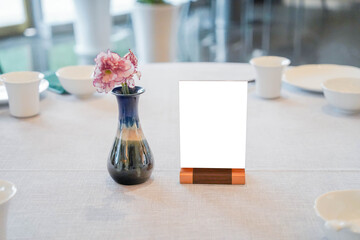 Stand Mock up Menu frame tent card. Menu card with empty space for text on table.